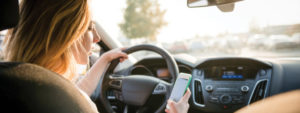 distracted driving woman looking at phone